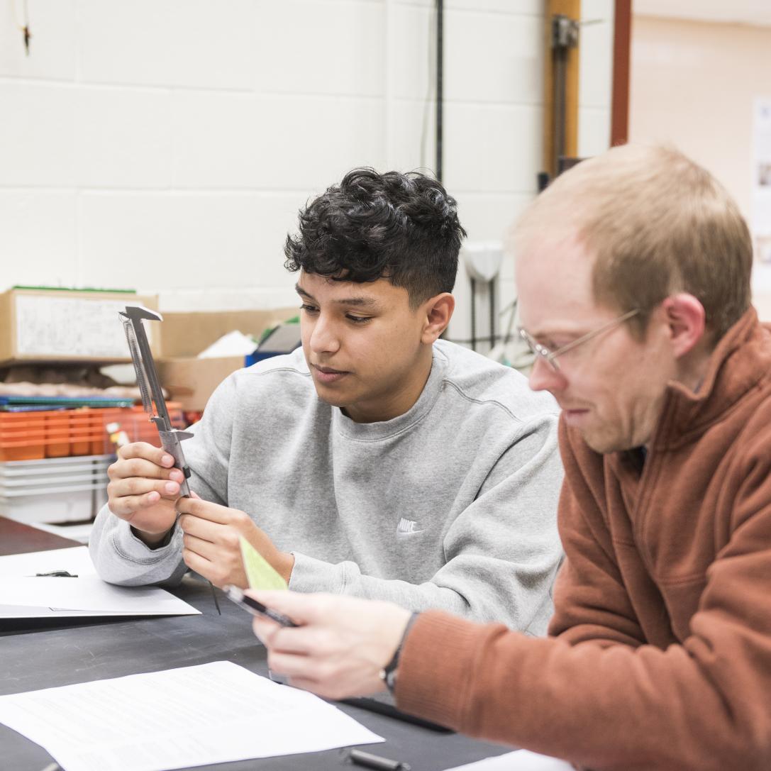 Physics student working on a lab experiment.